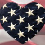 Heart with flag stars in front of American Flag